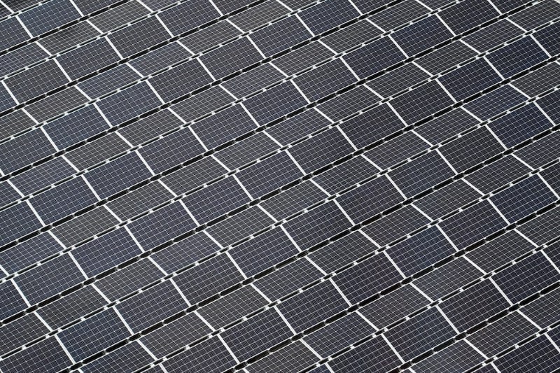 Aerial photograph of numerous solar panels